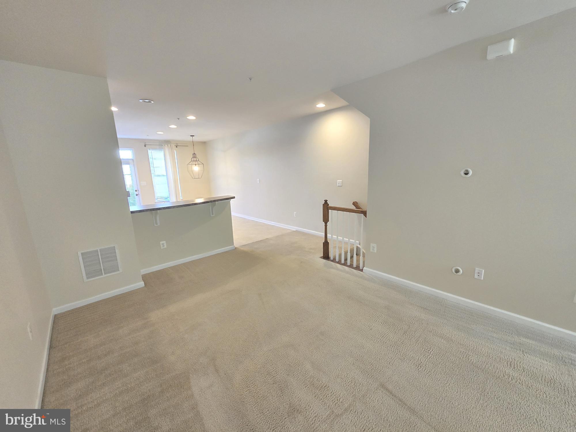 705 South Macon Street Baltimore, MD 21224 - Photo 15 of 29 wooden floor in an empty room with a window