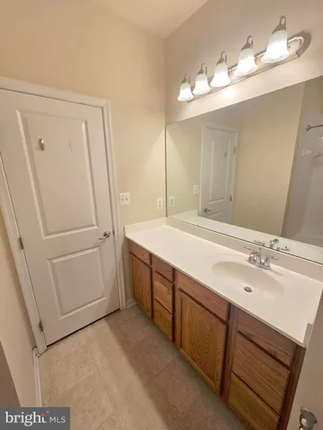 a white toilet sitting next to a bath tub and a shower
