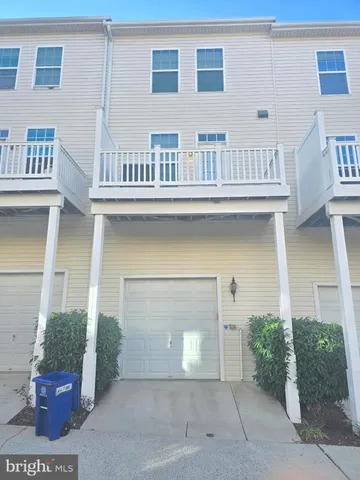 a front view of a house with a garage