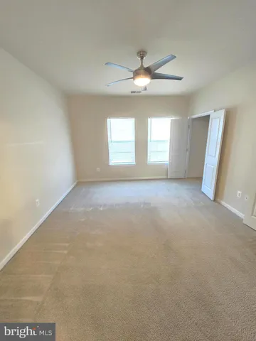 a view of a hallway with stairs