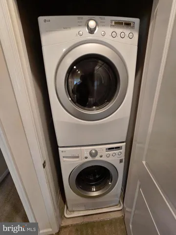 a bathroom with a toilet and a bath tub