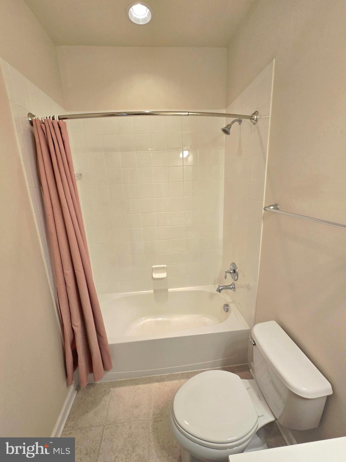 705 South Macon Street Baltimore, MD 21224 - Photo 25 of 29 a bathroom with a toilet and a bath tub