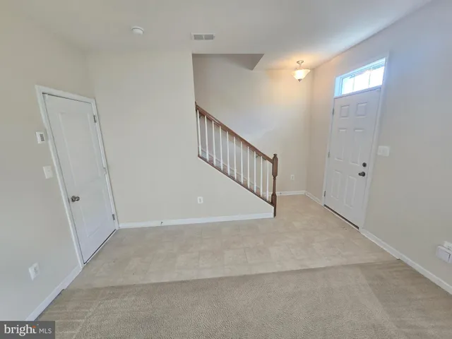 a large kitchen with stainless steel appliances granite countertop a stove a sink a refrigerator and a microwave