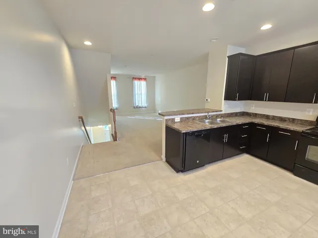 a view of a balcony with wooden floor and seating space