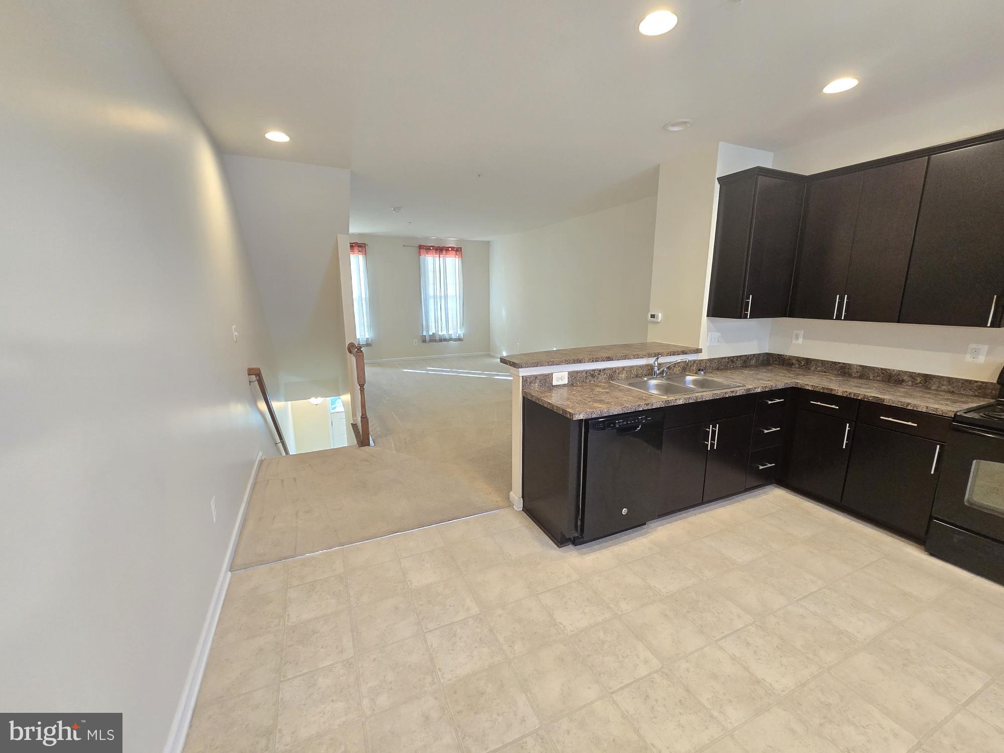 705 South Macon Street Baltimore, MD 21224 - Photo 8 of 29 a kitchen with a stove a sink and a refrigerator