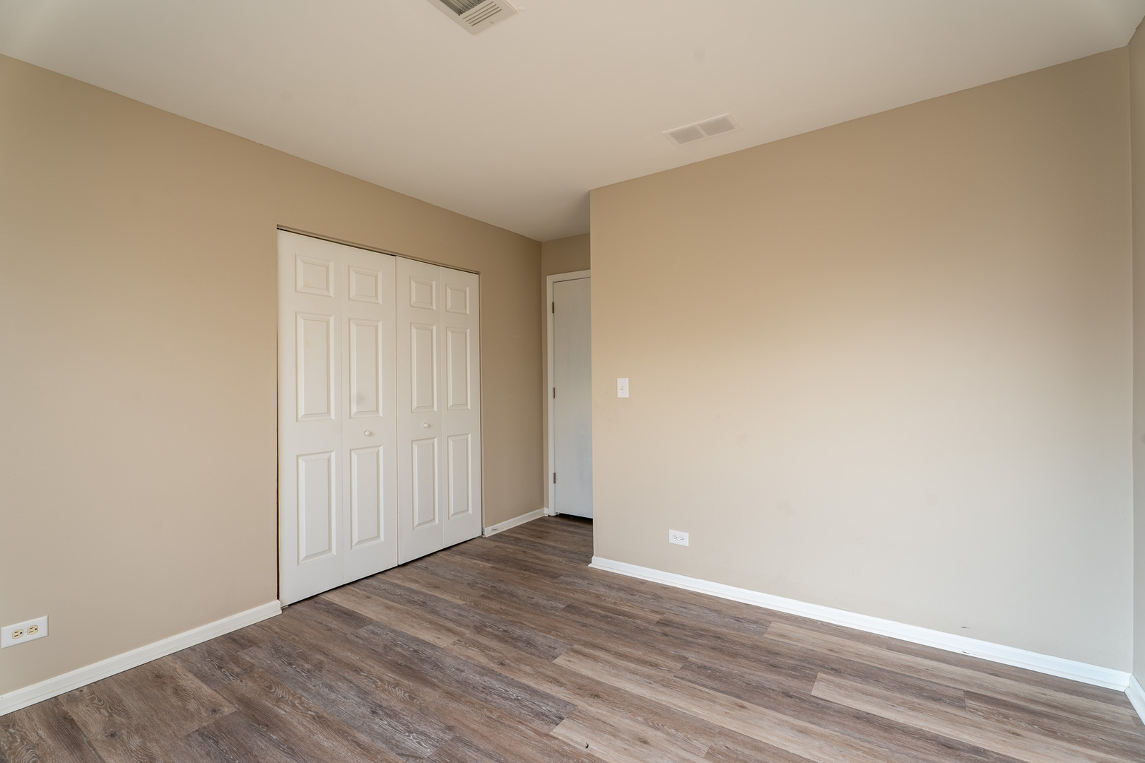 774 Terrace Court, Unit T Elgin, IL 60120 - Photo 17 of 27 a view of an empty room with wooden floor