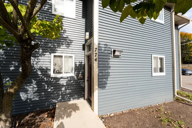 a view of a house with a small yard