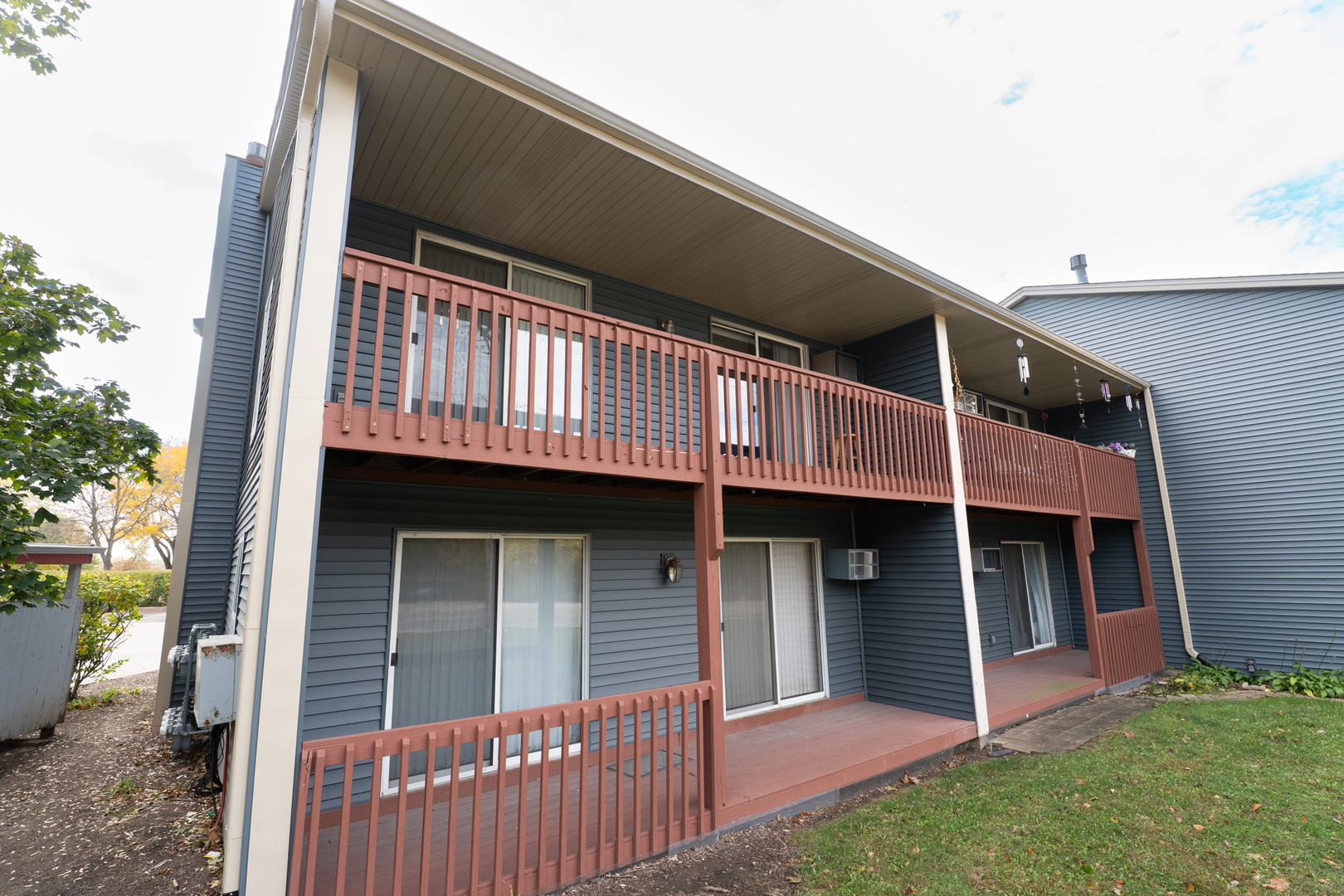 774 Terrace Court, Unit T Elgin, IL 60120 - Photo 22 of 27 a view of a house with a balcony