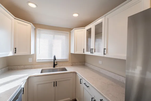 a kitchen with a sink and a window