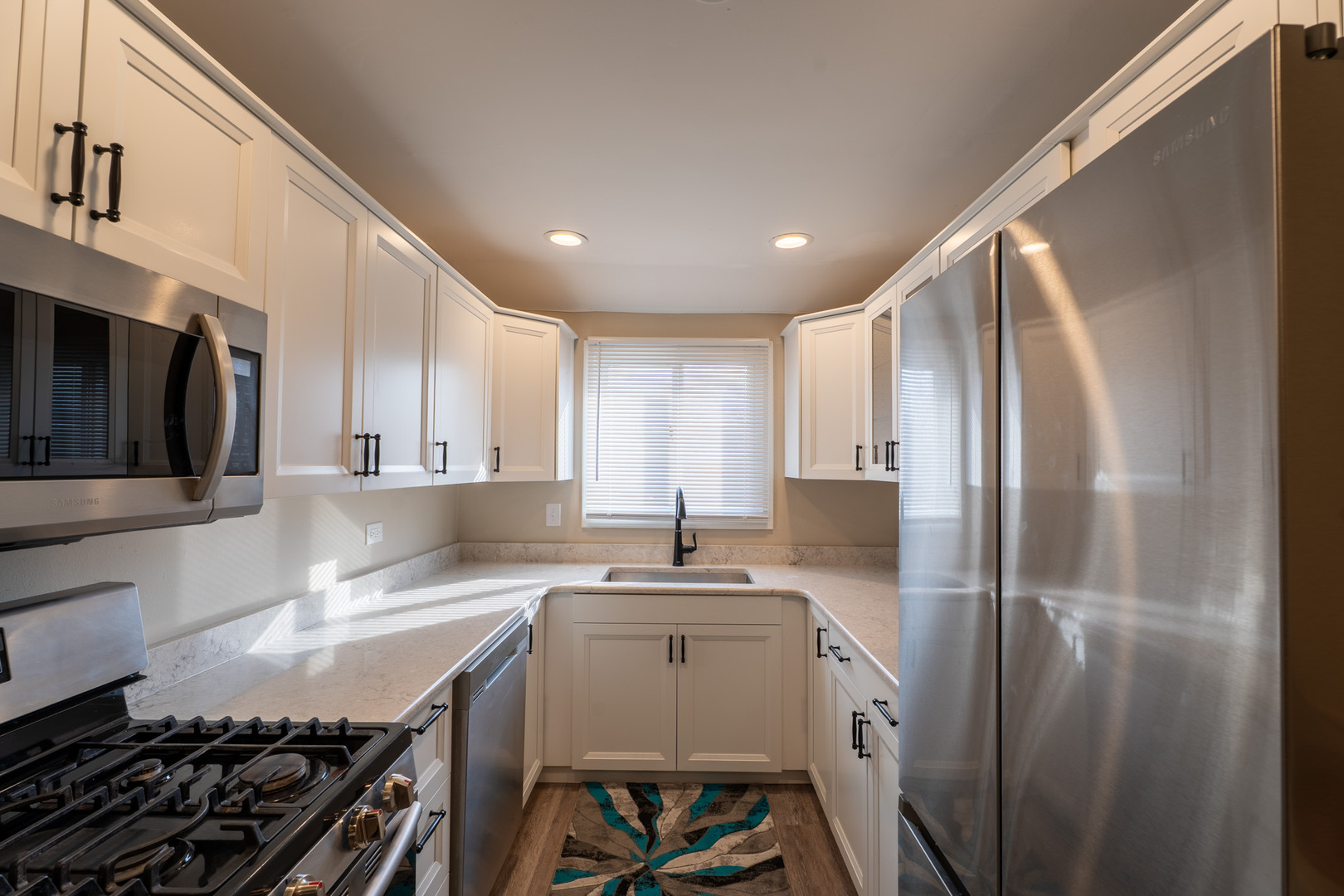 774 Terrace Court, Unit T Elgin, IL 60120 - Photo 5 of 27 a kitchen with a sink stove and refrigerator