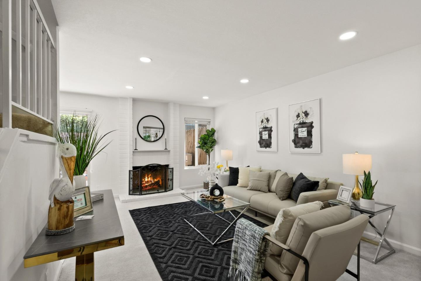 22812 Longdown Road Cupertino, CA 95014 - Photo 19 of 45 a living room with furniture and a fireplace