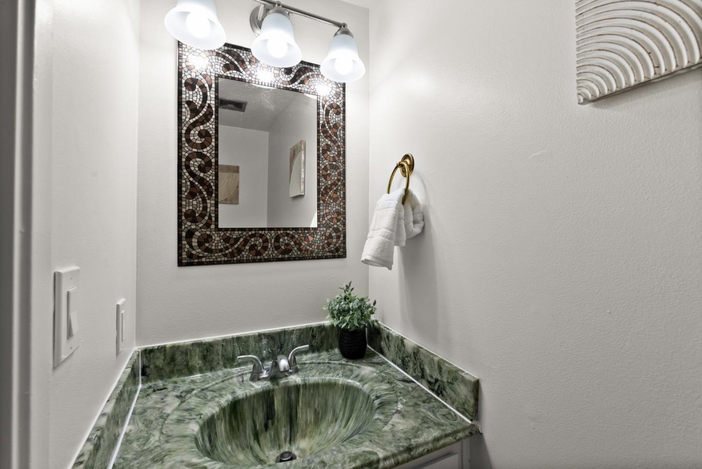 22812 Longdown Road Cupertino, CA 95014 - Photo 22 of 45 a bathroom with a sink and mirror
