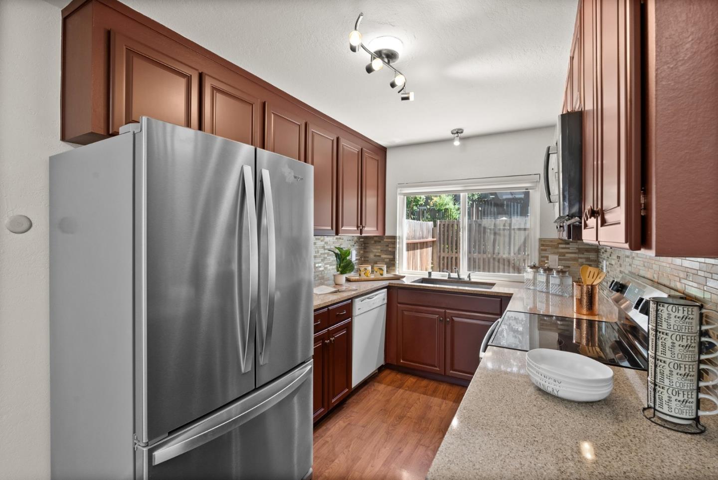 22812 Longdown Road Cupertino, CA 95014 - Photo 9 of 45 a kitchen with refrigerator and window