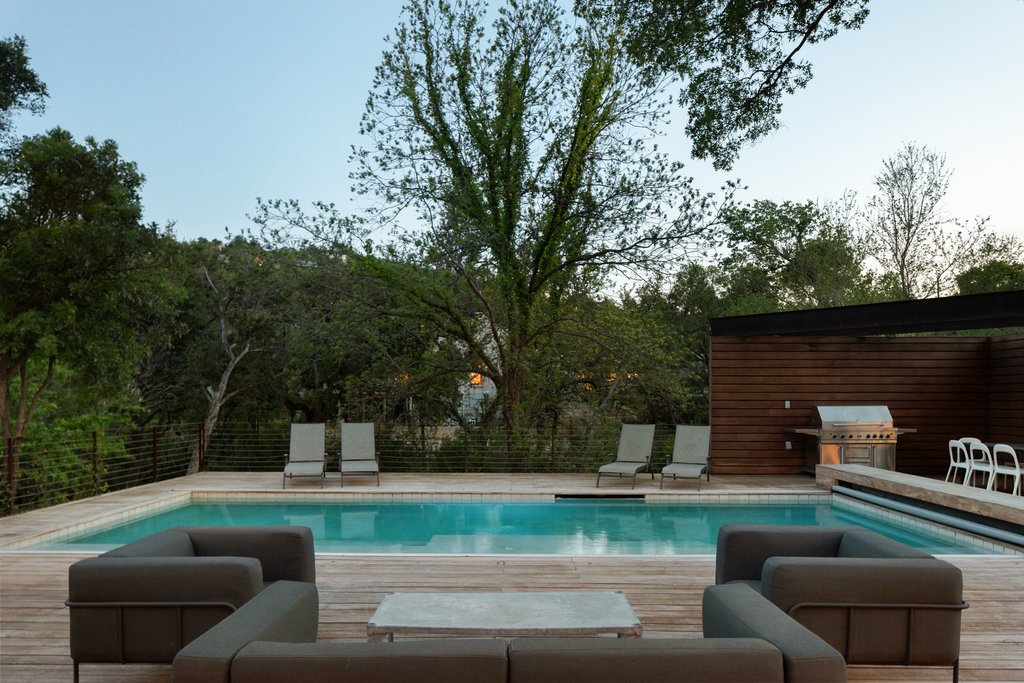 4707 Peace Pipe Path Austin, TX 78746 - Photo 11 of 40 a view of backyard with seating area and green space