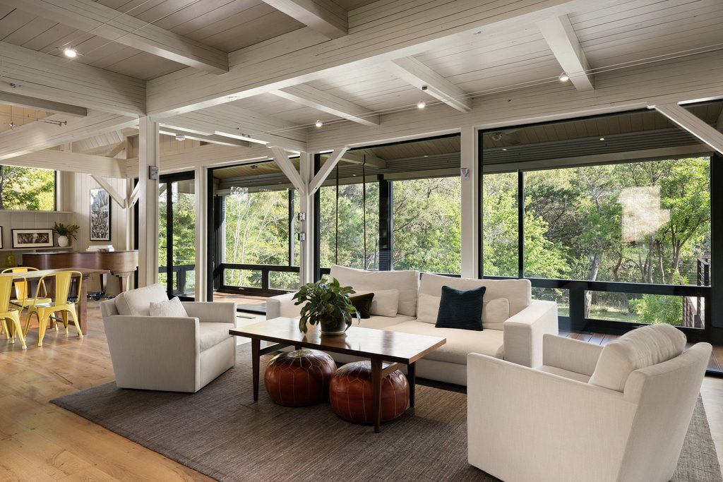 4707 Peace Pipe Path Austin, TX 78746 - Photo 16 of 40 a living room with furniture and a large window