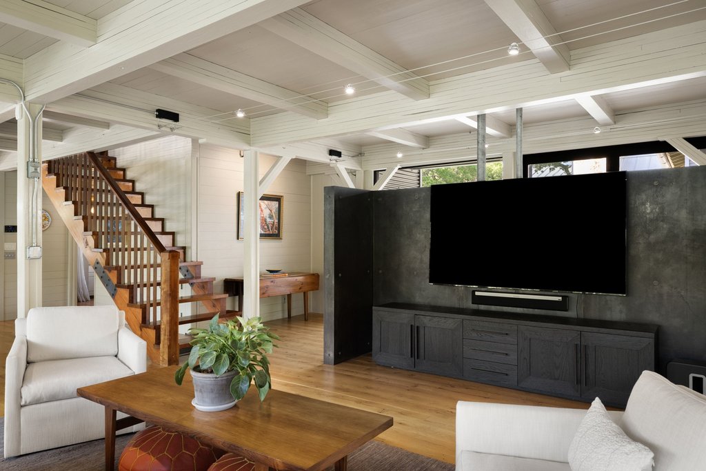 4707 Peace Pipe Path Austin, TX 78746 - Photo 18 of 40 a living room with furniture and a flat screen tv