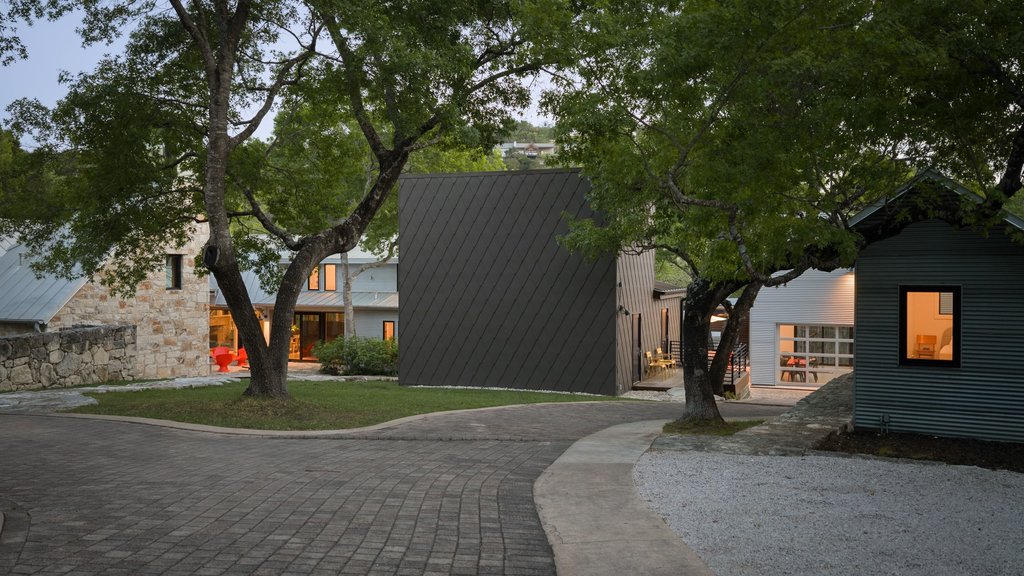 4707 Peace Pipe Path Austin, TX 78746 - Photo 2 of 40 a front view of a house with a yard