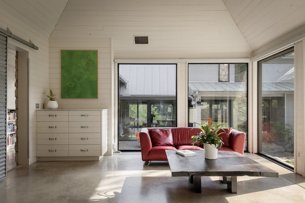 4707 Peace Pipe Path Austin, TX 78746 - Photo 21 of 40 a living room with furniture and a window