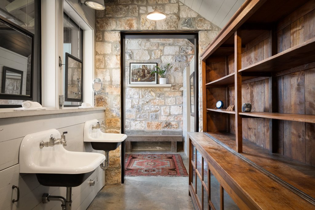 4707 Peace Pipe Path Austin, TX 78746 - Photo 22 of 40 a bathroom with a sink and a mirror