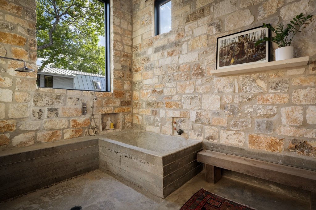 4707 Peace Pipe Path Austin, TX 78746 - Photo 23 of 40 a bathroom with a bathtub and sink