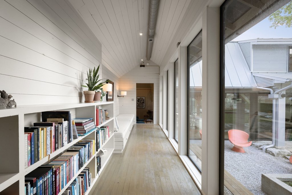 4707 Peace Pipe Path Austin, TX 78746 - Photo 26 of 40 a view of a hallway with wooden floor and entryway