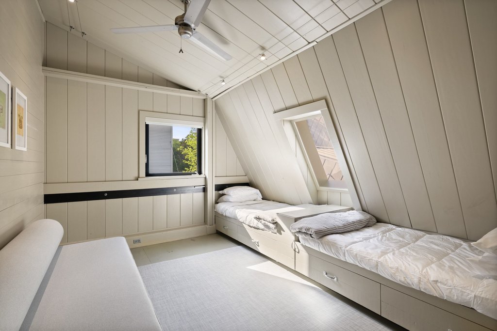 4707 Peace Pipe Path Austin, TX 78746 - Photo 29 of 40 a bedroom with a bed and a window