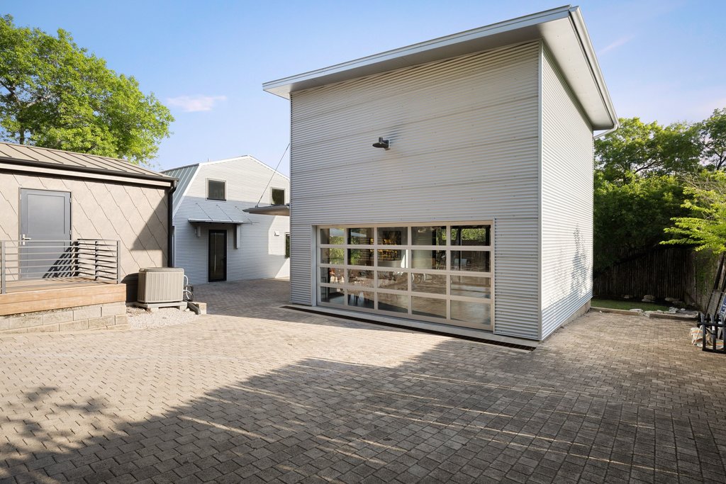 4707 Peace Pipe Path Austin, TX 78746 - Photo 32 of 40 a front view of a house with a yard