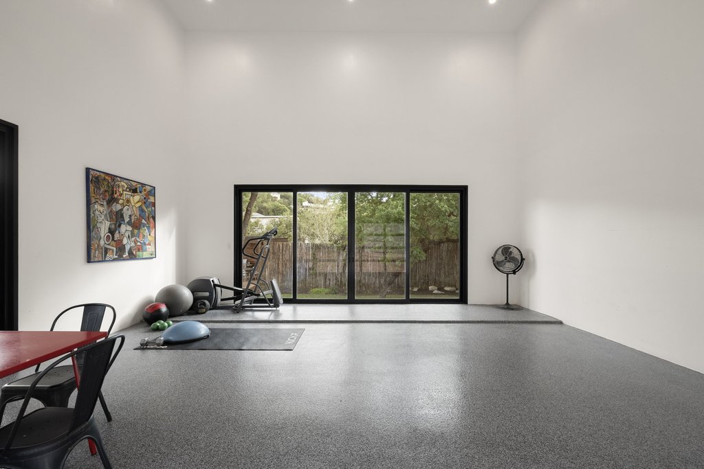 4707 Peace Pipe Path Austin, TX 78746 - Photo 33 of 40 a view of a room with gym equipment