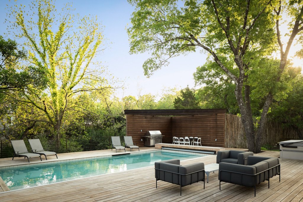 4707 Peace Pipe Path Austin, TX 78746 - Photo 10 of 40 a front view of a house with garden bath tub and couches
