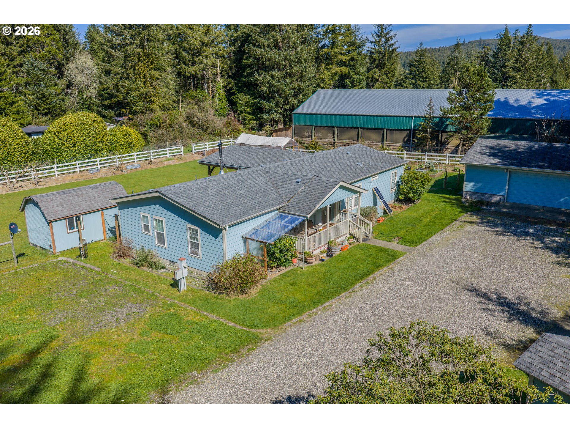 a aerial view of a house with a garden and plants