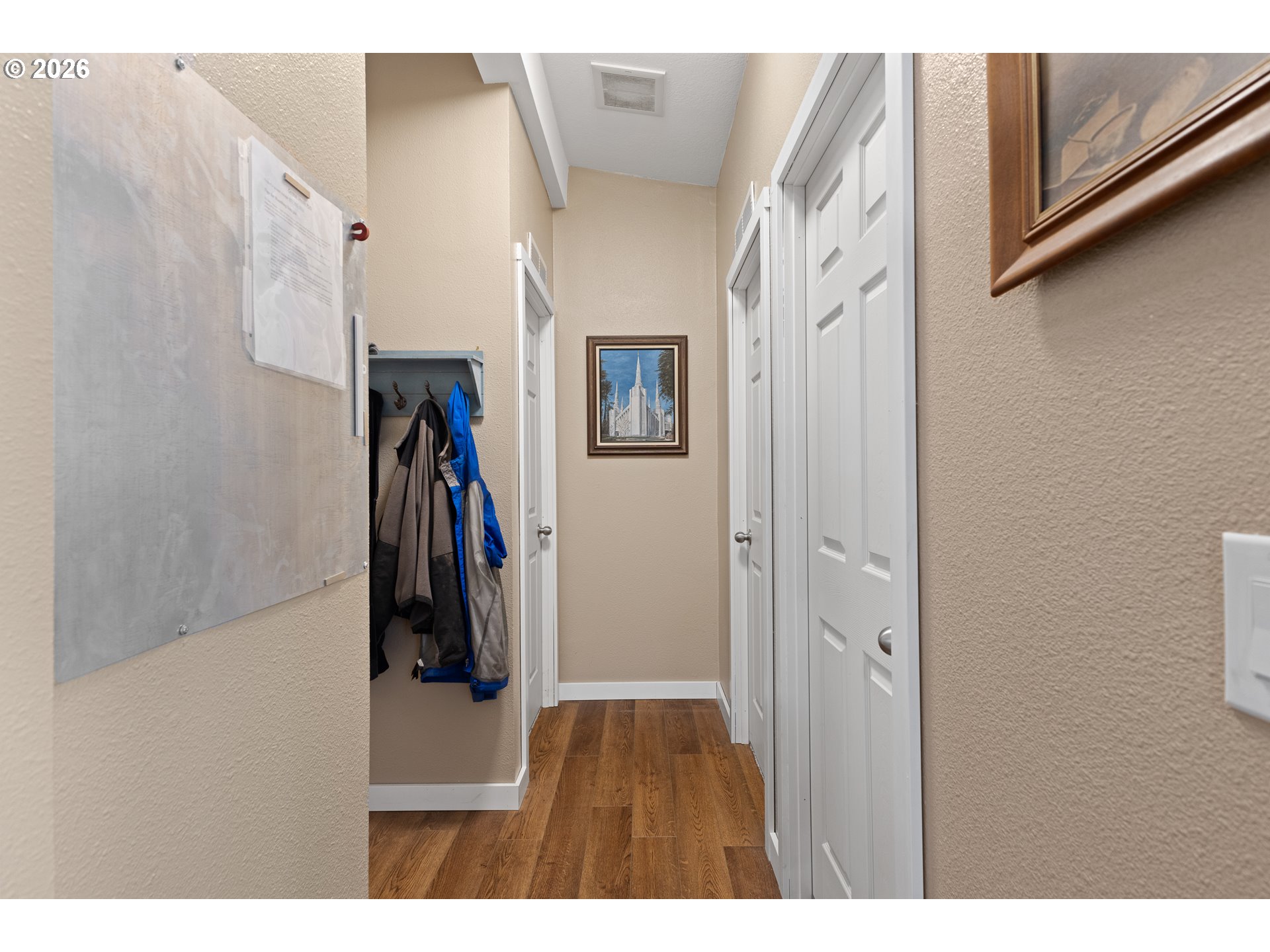 69323 Wildwood Road North Bend, OR 97459 - Photo 12 of 37 a view of a hallway with wooden floor and stairs