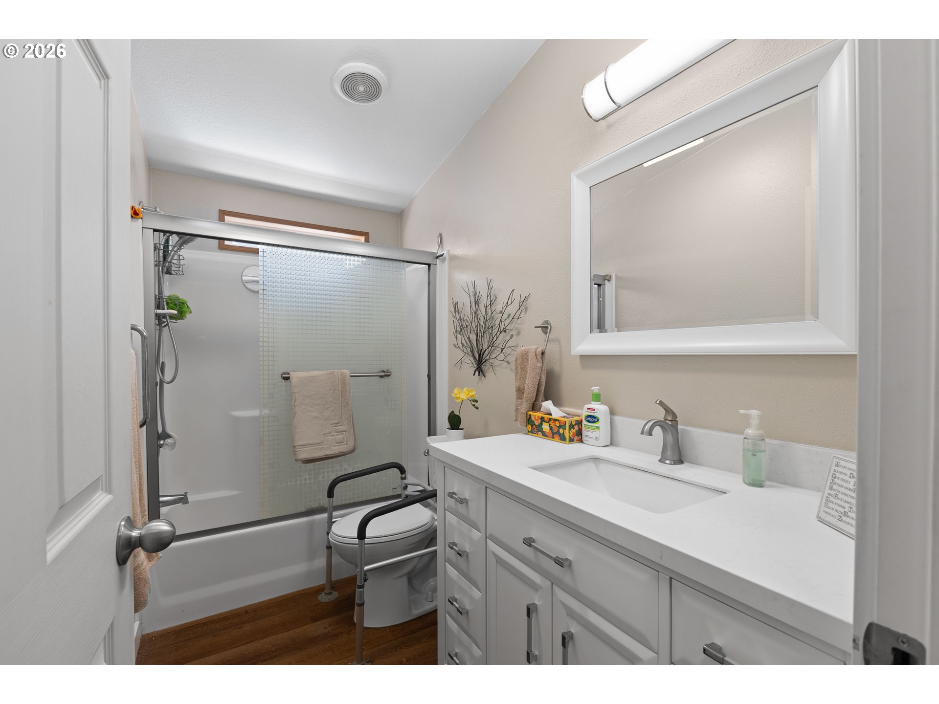 69323 Wildwood Road North Bend, OR 97459 - Photo 18 of 37 a bathroom with a sink mirror vanity and shower