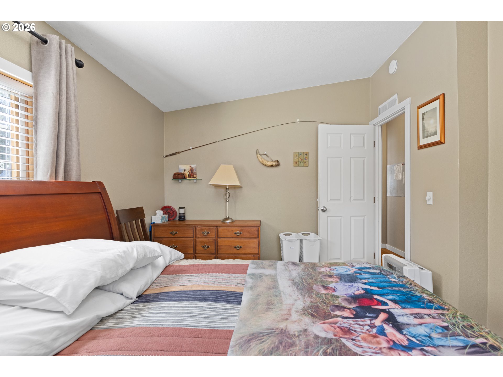 69323 Wildwood Road North Bend, OR 97459 - Photo 22 of 37 a bedroom with a large bed and wooden floor