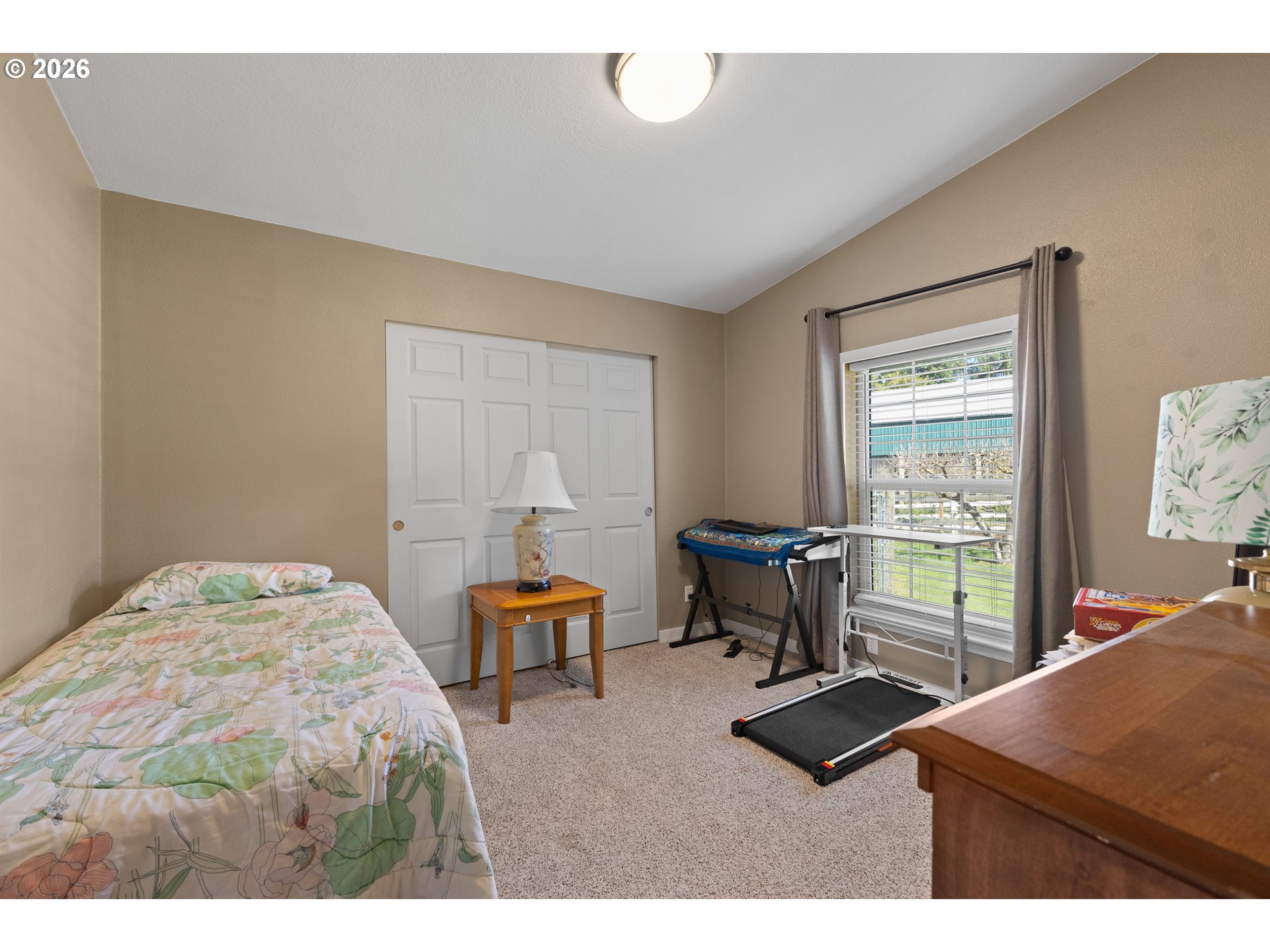 69323 Wildwood Road North Bend, OR 97459 - Photo 23 of 37 a bedroom with furniture and a window