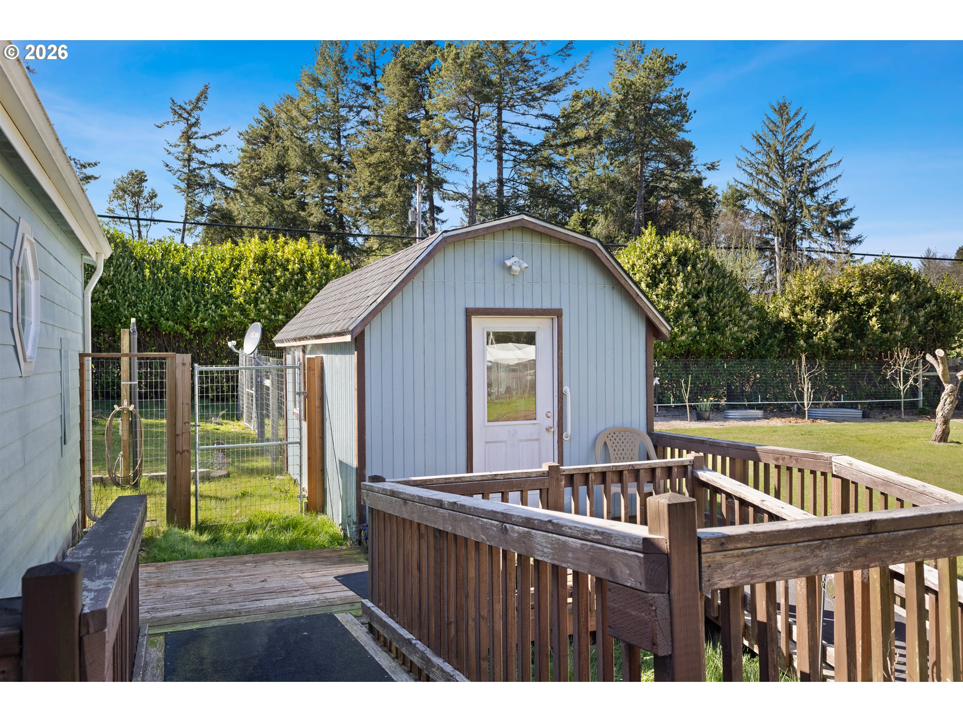 69323 Wildwood Road North Bend, OR 97459 - Photo 25 of 37 a view of a wooden deck and a forest