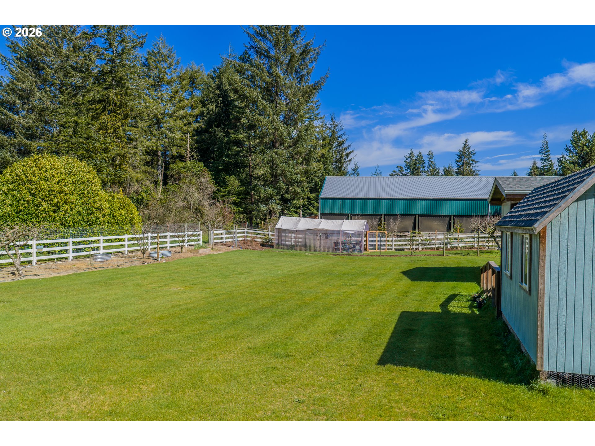 69323 Wildwood Road North Bend, OR 97459 - Photo 29 of 37 a view of a swimming pool with a yard