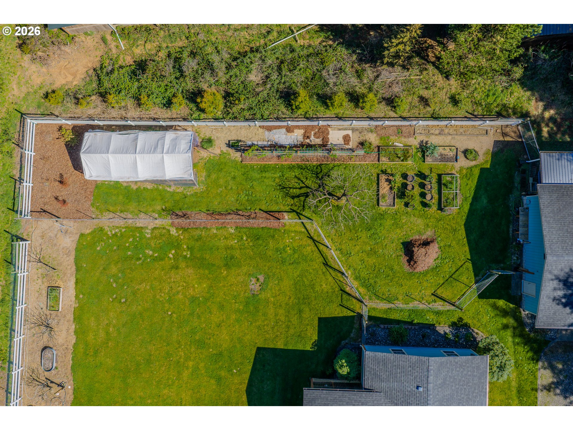 69323 Wildwood Road North Bend, OR 97459 - Photo 31 of 37 a bird view of a house with a garden