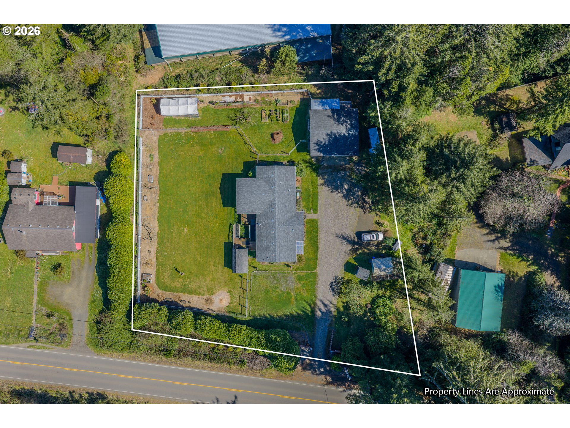 69323 Wildwood Road North Bend, OR 97459 - Photo 35 of 37 an aerial view of a house with a yard