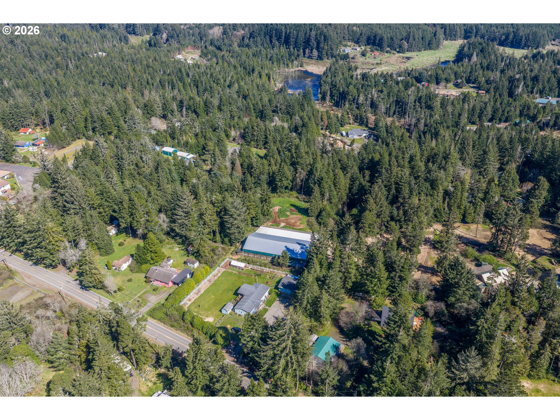 69323 Wildwood Road North Bend, OR 97459 - Photo 36 of 37 a aerial view of a house with a yard