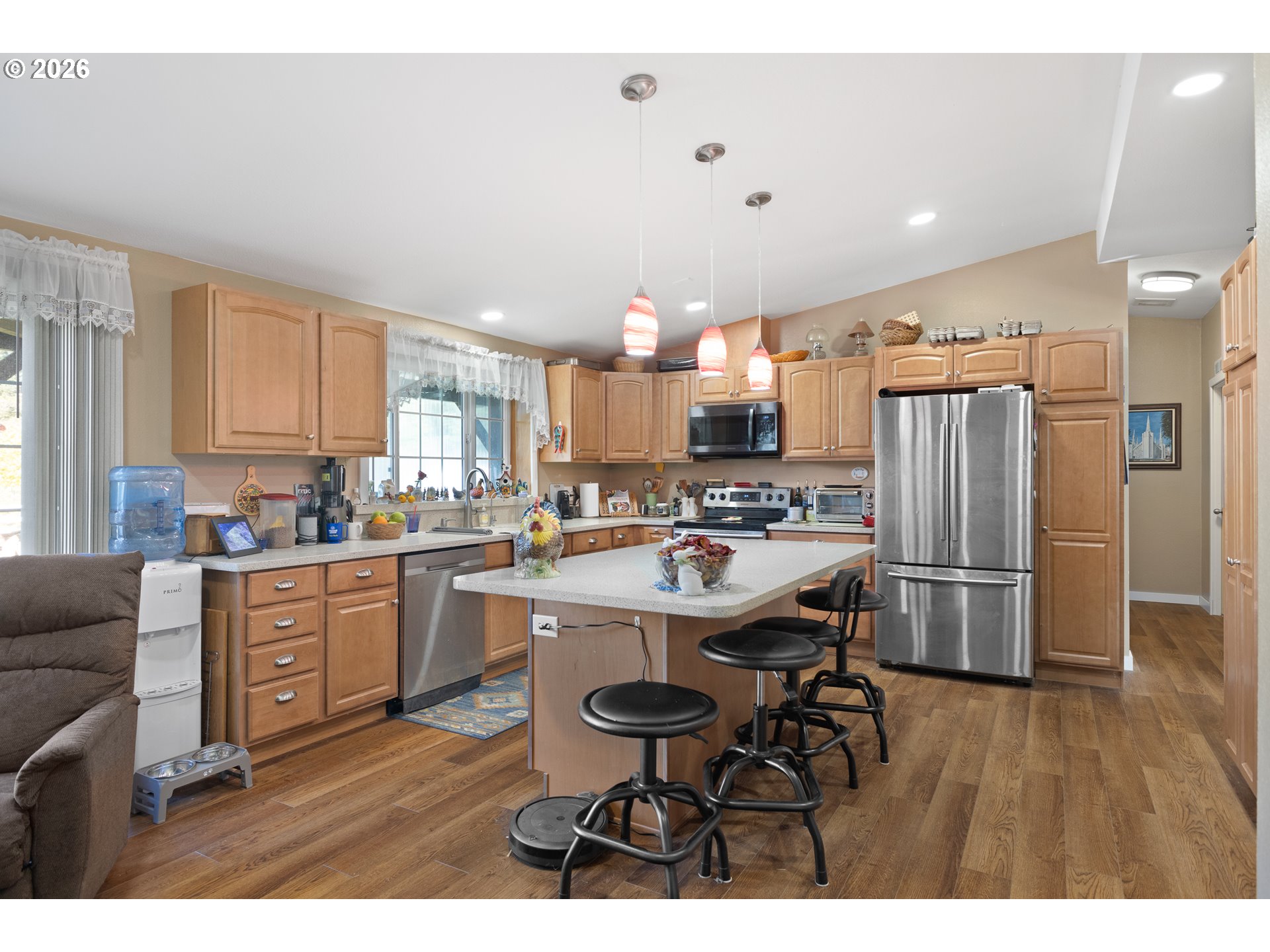 69323 Wildwood Road North Bend, OR 97459 - Photo 9 of 37 a kitchen with stainless steel appliances a sink a stove a refrigerator and cabinets