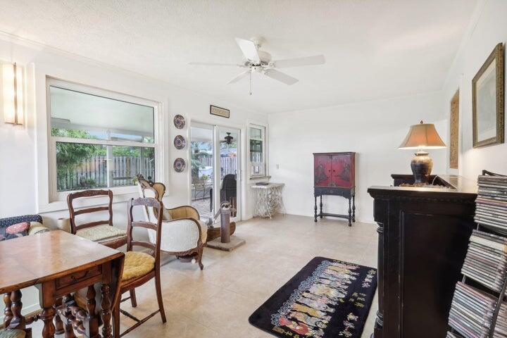 4844 Southeast Pilot Way Stuart, FL 34997 - Photo 12 of 44 a living room with furniture a chandelier and a window