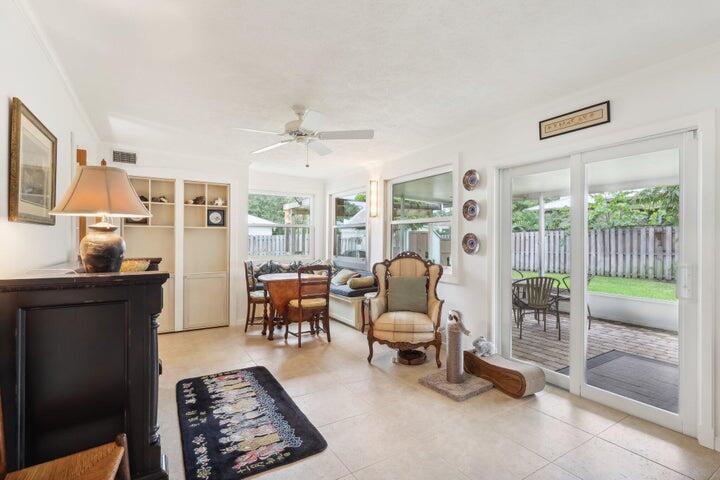 4844 Southeast Pilot Way Stuart, FL 34997 - Photo 13 of 44 a living room with furniture and a floor to ceiling window