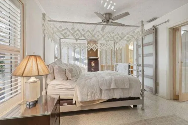 a bedroom with a bed and a table