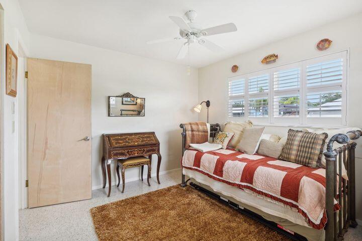 4844 Southeast Pilot Way Stuart, FL 34997 - Photo 24 of 44 a bedroom with furniture and a window