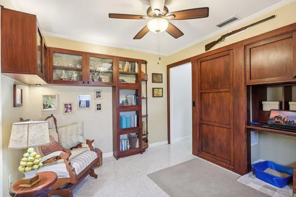 a bedroom with furniture and a window
