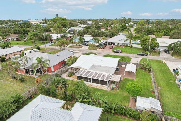 4844 Southeast Pilot Way Stuart, FL 34997 - Photo 44 of 44 an aerial view of residential houses with outdoor space and street view