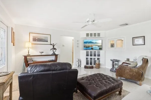 a living room with furniture rug and window