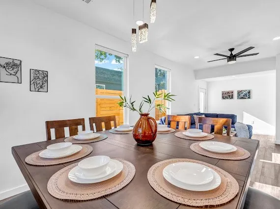 a kitchen with furniture and a dining table