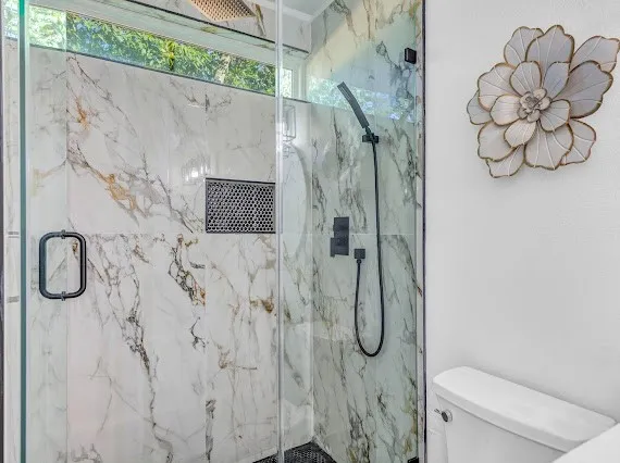 a bathroom with a shower curtain and a sink