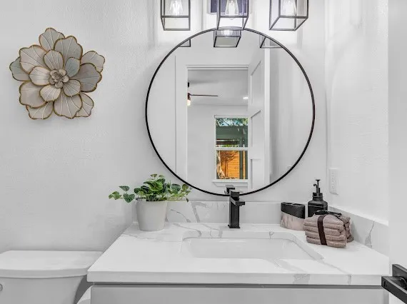 a bathroom with a sink and a mirror